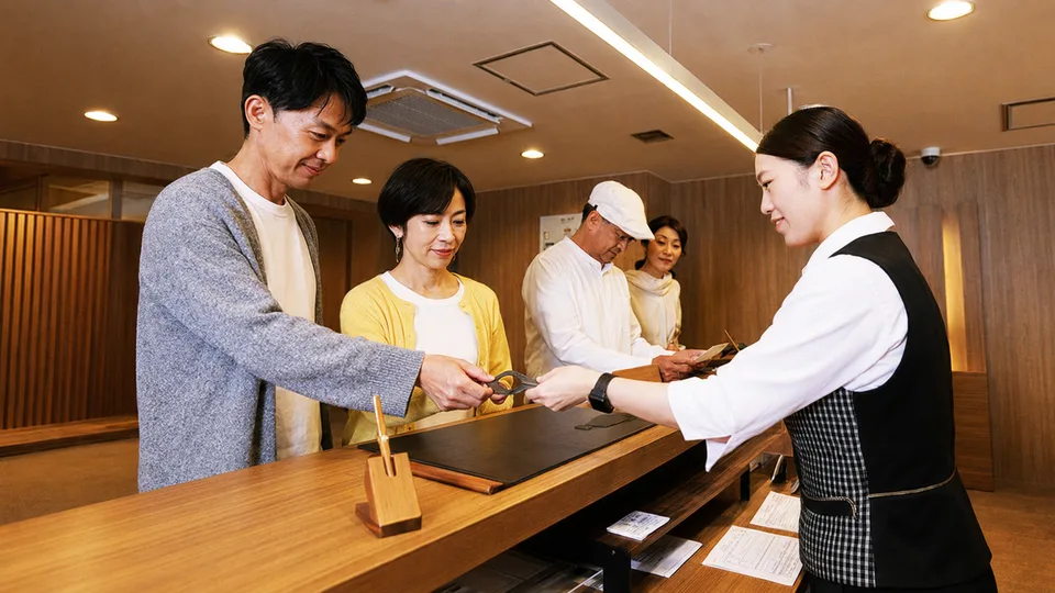 The tap-to-pay wristband used throughout the inn